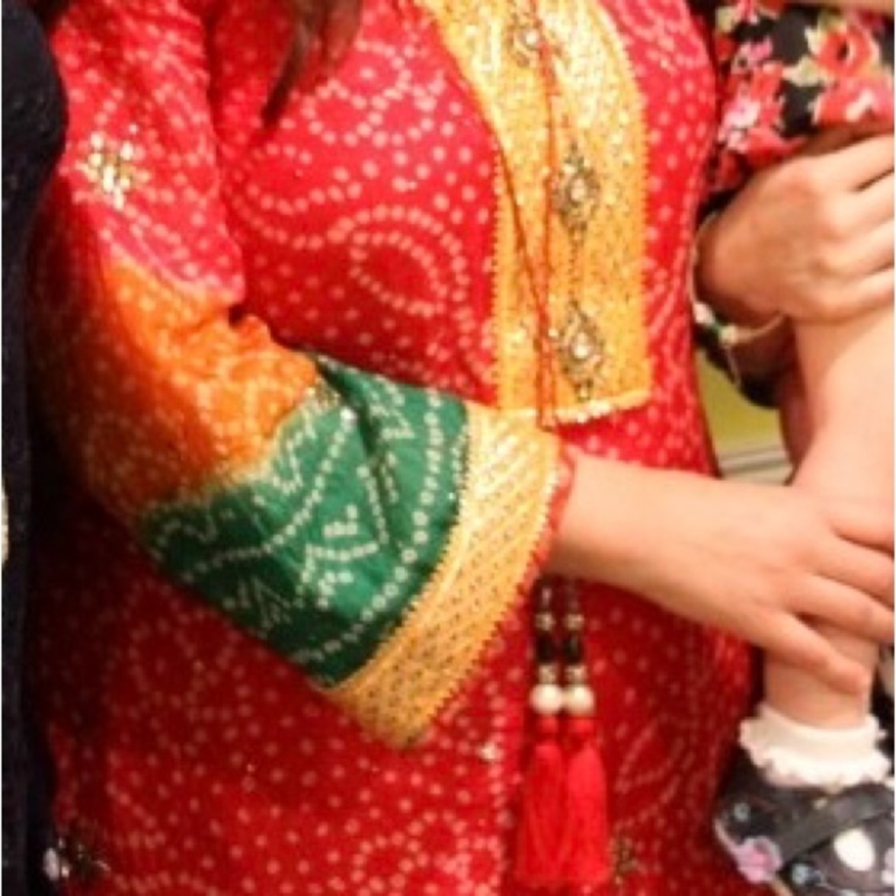 Red,orange, green choonri kameez with gold appliqué on Sleeves and neckline
